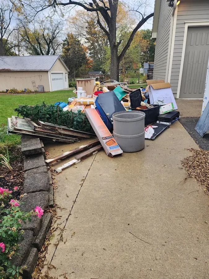Dumpster being loaded with debris for 3 Yard Dumpster Rental in Candlewick Lake